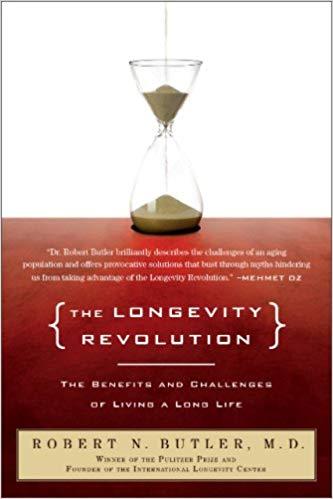 A quote from Mehmet Oz that says, "Dr. Robert Butler brilliantly describes the challenges of an aging population and offers provocative solutions that bust through myths hindering us from taking advantage of the Longevity Revolution."
In square brackets the title "The Longevity Revolution" above a white line that separates it from the text "The benefits and challenges of living a long life." At the bottom of the image it says "Robert N. Butler, M.D. Winner of the Pulitzer Prize and founder of the International Longevity Center