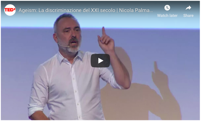 A man with a headset on speaking to an audience. The caption above reads "TEDx Ageism: La discriminazione del XXI secolo | Nicola Palma"