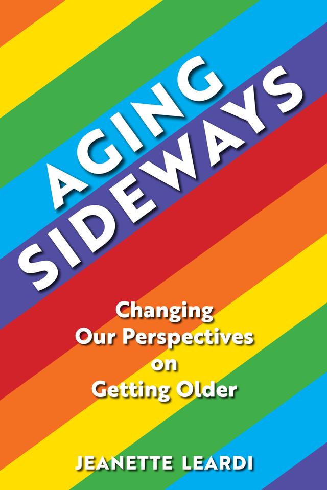 The image is a book cover with a rainbow-colored background. The title of the book is "Aging Sideways" in large white letters. The subtitle is "Changing Our Perspectives on Getting Older" in smaller white letters. The author's name, "JEANETTE LEARDI," is at the bottom of the cover in white letters against a green background. The cover design is simple and eye-catching, using bold colors and typography to draw attention to the title and author. The rainbow background suggests a sense of diversity and inclusion, while the title, "Aging Sideways," implies a more unconventional and positive approach to getting older. The subtitle further emphasizes the book's focus on changing one's perspective on aging. Overall, the cover effectively conveys the book's message and invites readers to explore its content. 