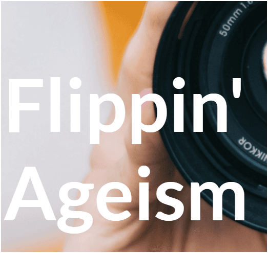 The words "Flippin' Ageism" in front of a partial view of a hand holding up a camera lens.